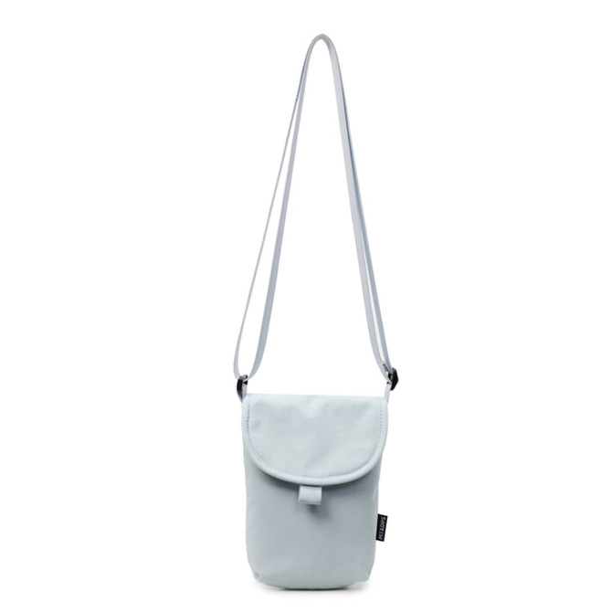 A small size canvas shoulder bag in light blue with an adjustable strap and a flap closure. Features a branding logo.