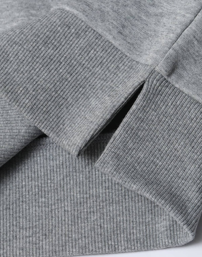 A grey unisex crew neck sweater featuring ribbed cuffs and hem with a logo present.