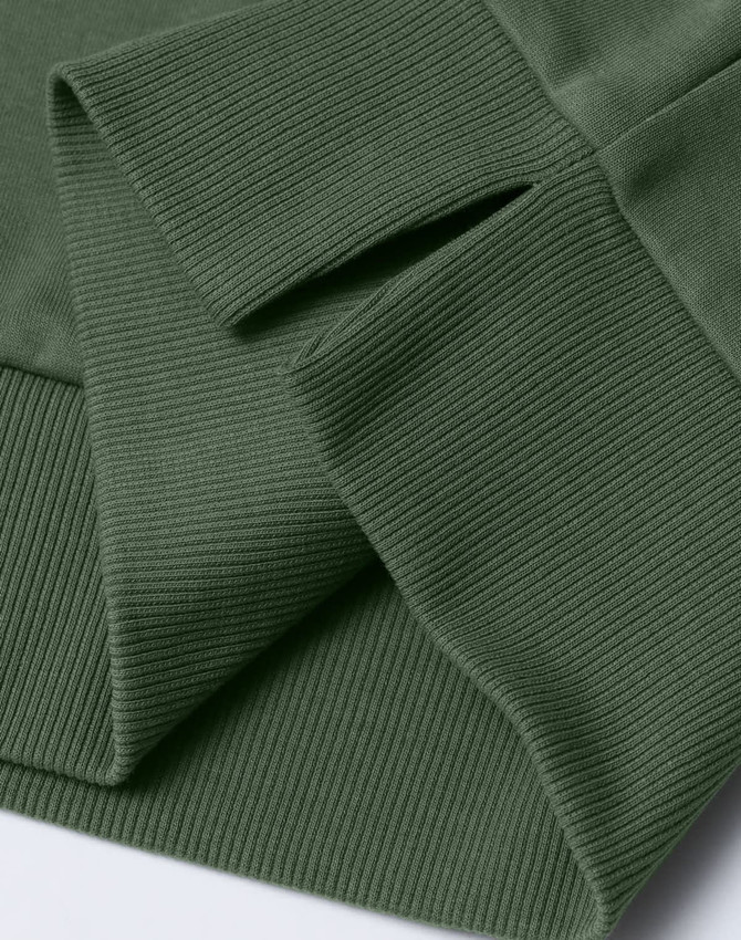 A close-up of a green unisex crew neck sweater, highlighting the ribbed cuffs and hem. The fabric appears soft and comfortable.
