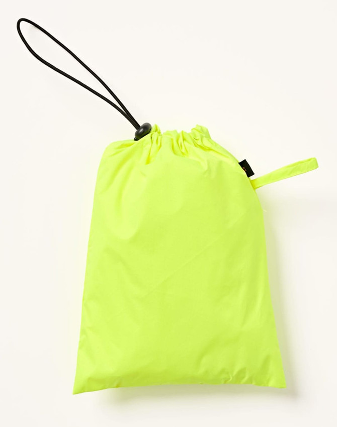 A bright yellow nylon pouch with a drawstring closure, suitable for storing lightweight waterproof rain pants.