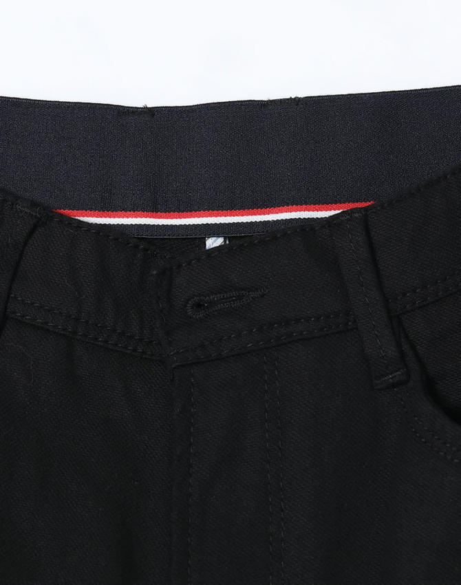 Black men's flexi chino pants with a waistband detail and a logo.