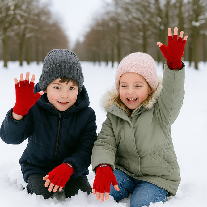 Red fingerless gloves worn by children, smiling and raising their hands, set in a snowy outdoor environment.