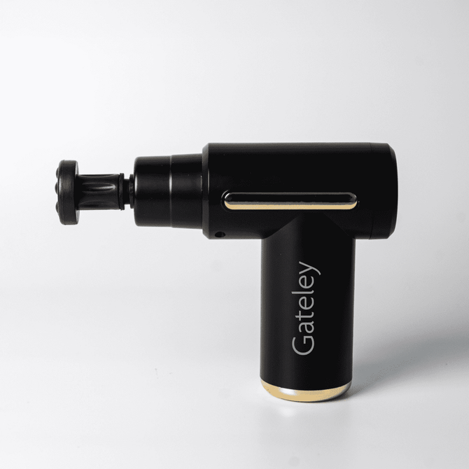 A black massage gun with gold accents and a branding logo, featuring an adjustable head for targeted relief.