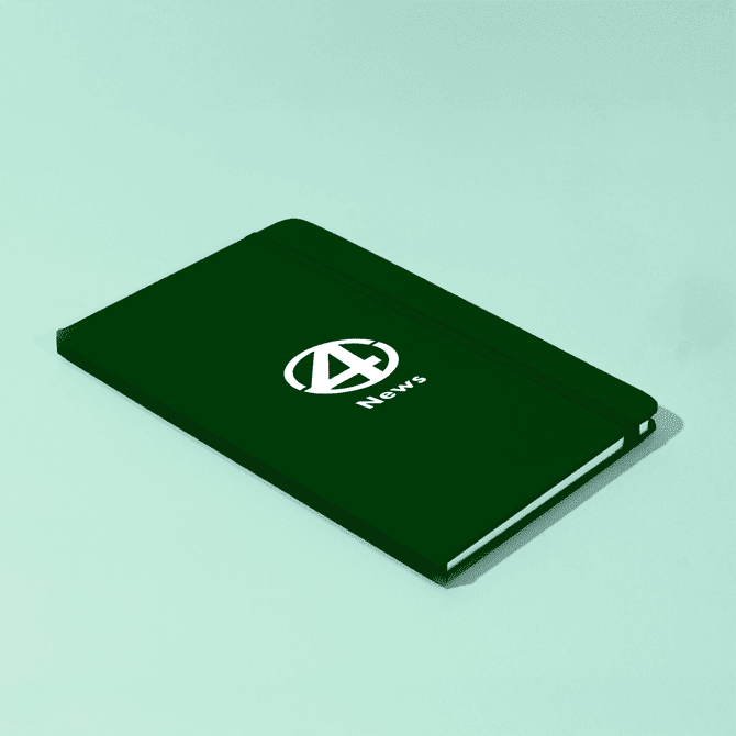 A green A5 notebook with a logo on the cover, featuring a sleek, minimalist design.
