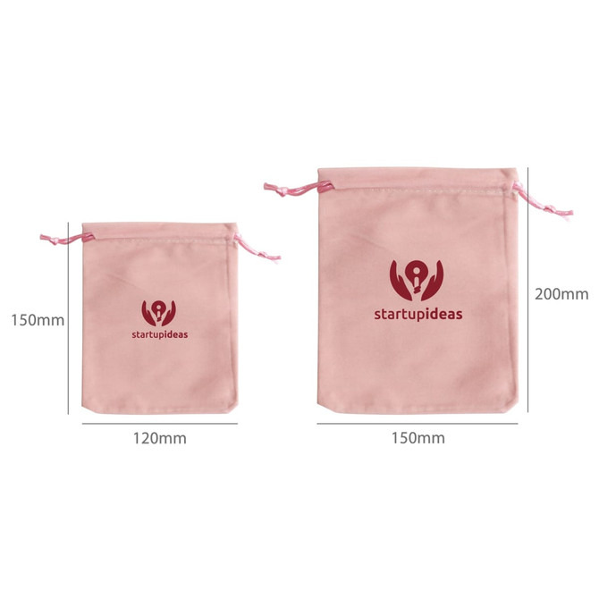 Two pink velvet drawstring bags of varying sizes, featuring a logo on the front. Dimensions are included. Two pink velvet drawstring bags of varying sizes, featuring a logo on the front. Dimensions are included.