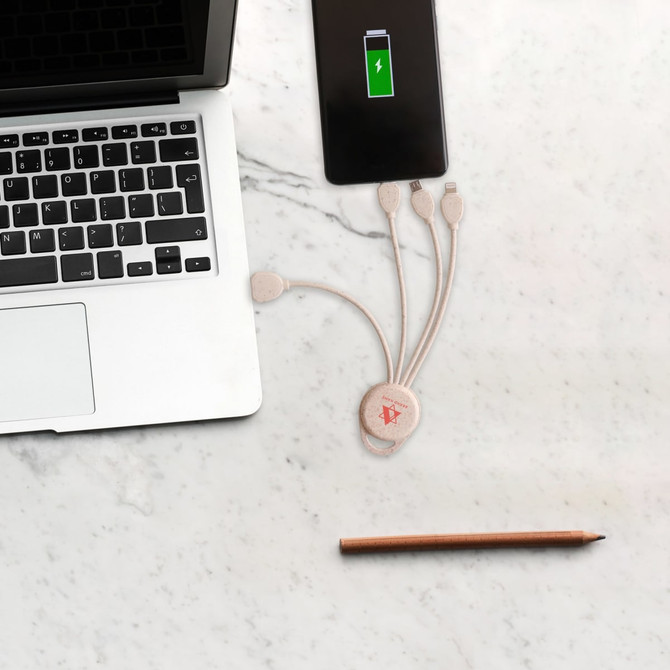 A round wheat straw charging cable in cream, with multiple connectors, next to a laptop and smartphone on a marble surface. A round wheat straw charging cable in cream, with multiple connectors, next to a laptop and smartphone on a marble surface.