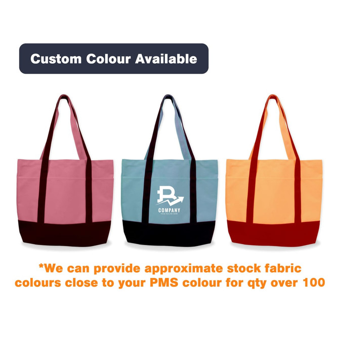 A small canvas tote bag in pink, blue, and orange, featuring a logo and contrasting base colours. A small canvas tote bag in pink, blue, and orange, featuring a logo and contrasting base colours.