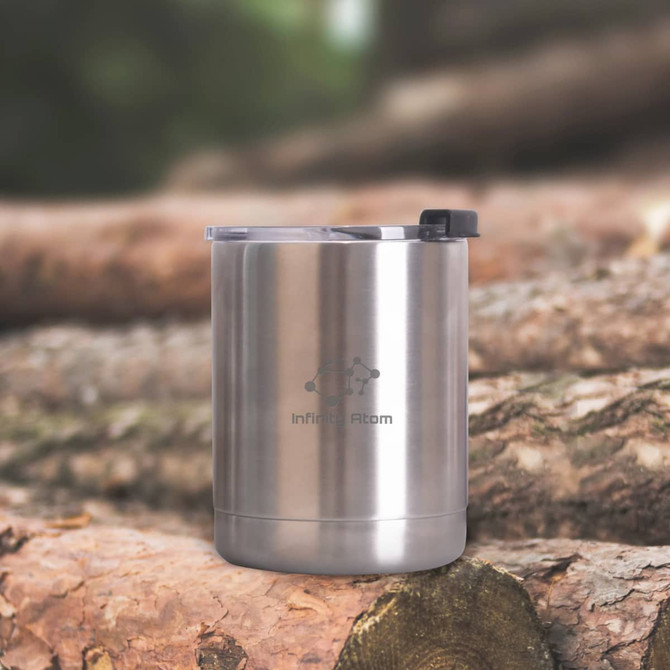 A drink bottle featuring a sleek stainless steel design with a clear lid and a logo. Set against a natural wood backdrop. A drink bottle featuring a sleek stainless steel design with a clear lid and a logo. Set against a natural wood backdrop.