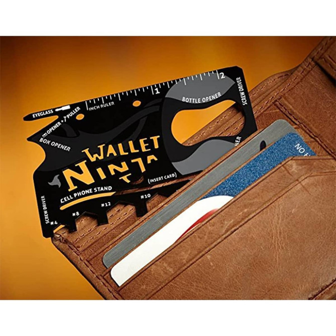A black card-sized multi-tool with various functions, positioned inside a brown wallet, featuring a logo.