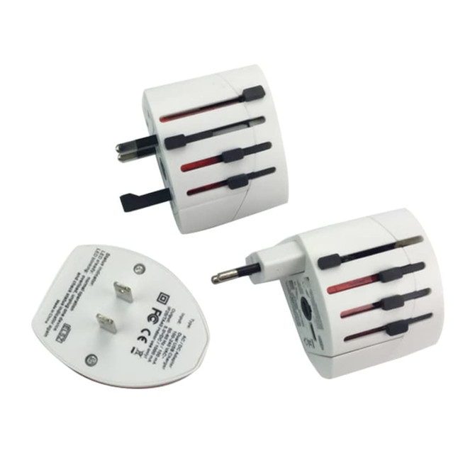 A white travel adapter with multiple plug options and a USB port, featuring a logo on the surface.