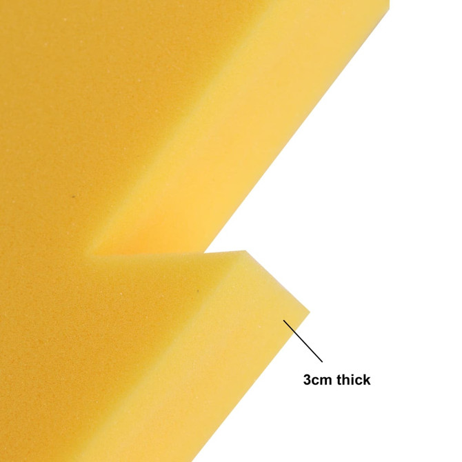 A close-up of a yellow sponge material, featuring a 3 cm thick cut. The sponge has a smooth surface.