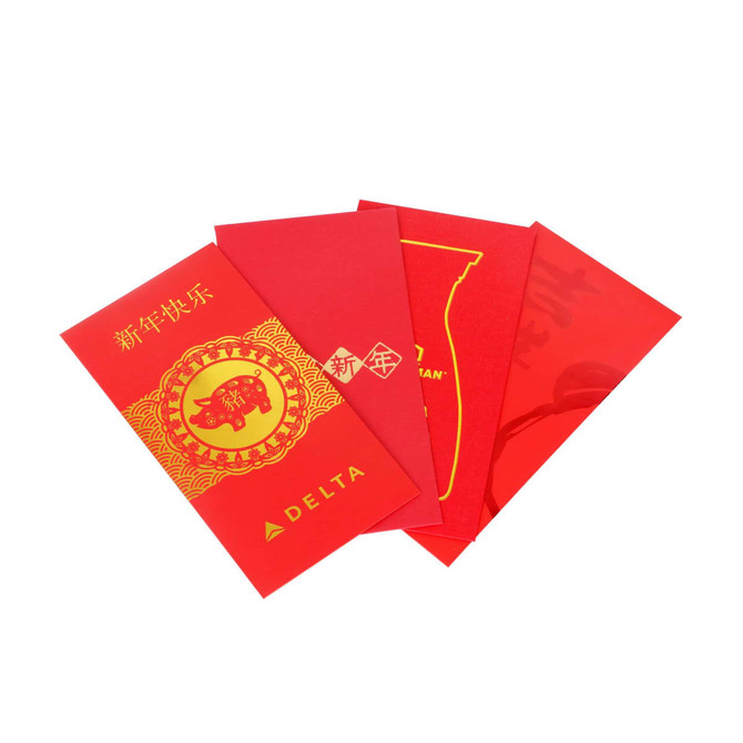 A set of four red envelopes displaying various designs, featuring gold accents and a logo.