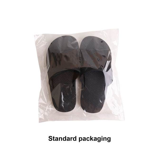 A pair of black EVA slides packaged in a clear plastic bag. The slides have a textured surface and a simple design. A pair of black EVA slides packaged in a clear plastic bag. The slides have a textured surface and a simple design.