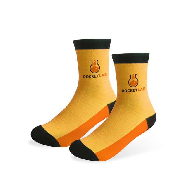 Ankle custom pattern woven bamboo socks in yellow, orange, and black with a logo on one side. Ankle custom pattern woven bamboo socks in yellow, orange, and black with a logo on one side.