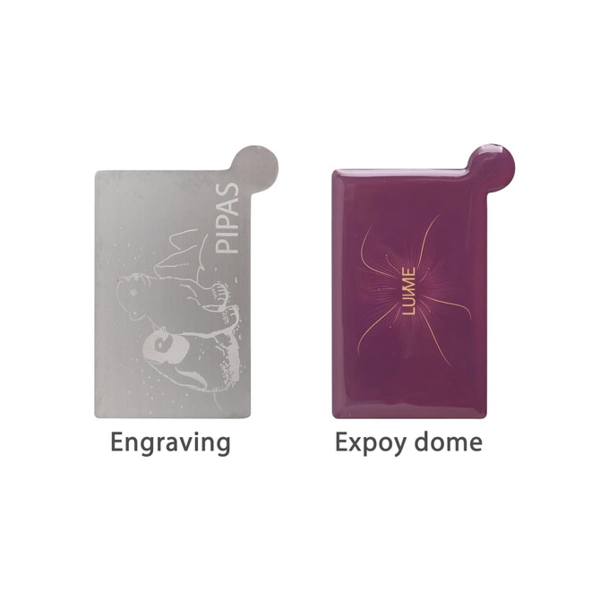 A stainless steel portable mirror featuring a silver engraved surface and a purple epoxy dome. It has a branding logo. A stainless steel portable mirror featuring a silver engraved surface and a purple epoxy dome. It has a branding logo.
