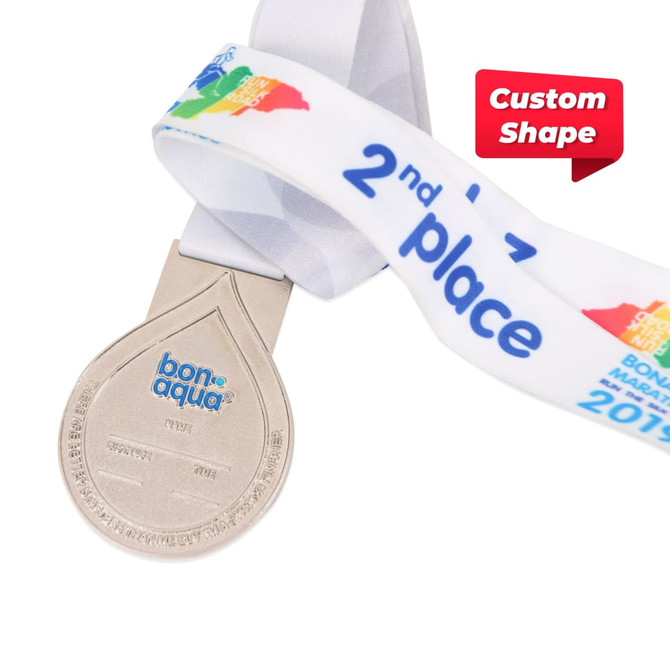 A silver medal with a custom shaped design and a patterned ribbon featuring various colours. A silver medal with a custom shaped design and a patterned ribbon featuring various colours.