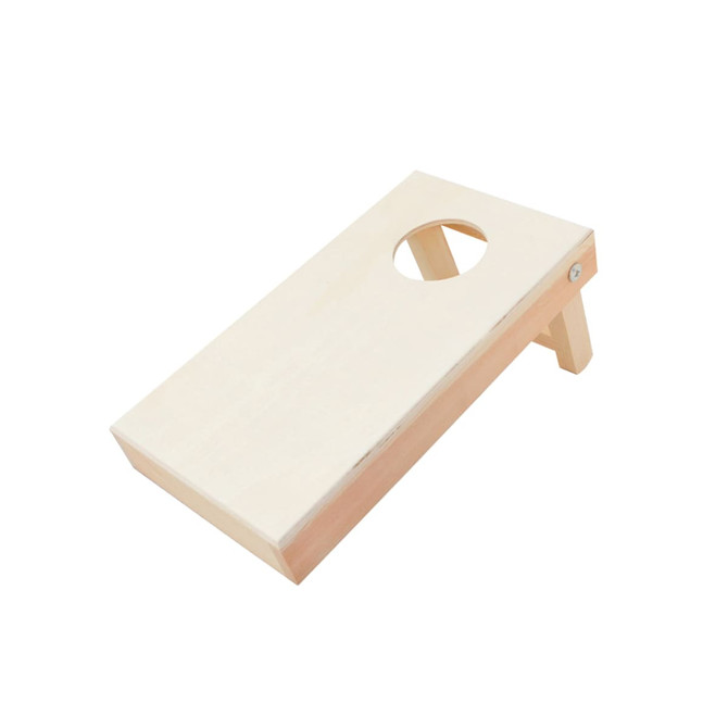 A mini cornhole game board in a natural wood finish, featuring an angled design and a round hole.