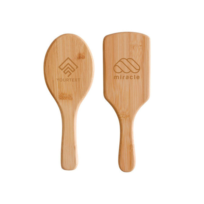 A bamboo hairbrush featuring a smooth, rounded design with a handle. It has two sides, each with different engravings.