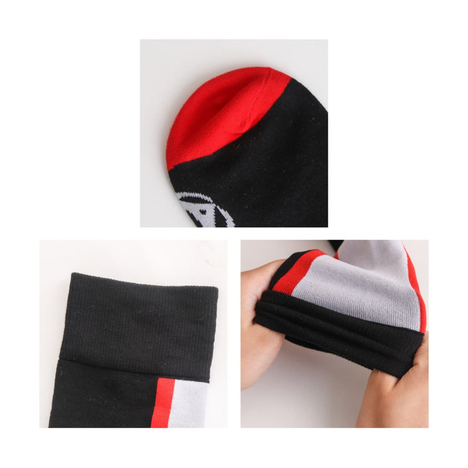Knee high socks in black with red and white accents, featuring a branded logo. Close-up of toe and cuff details. Knee high socks in black with red and white accents, featuring a branded logo. Close-up of toe and cuff details.