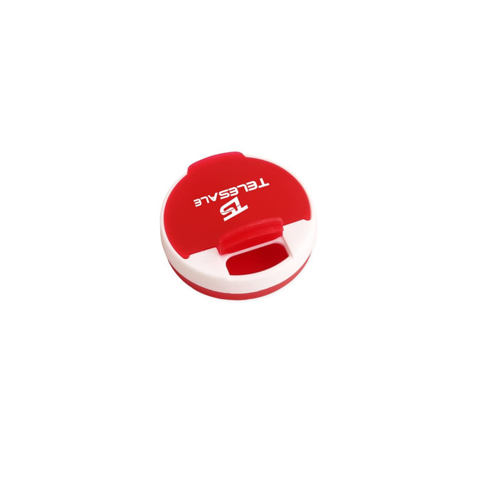 A round pill box in red and white, featuring a logo on the top.