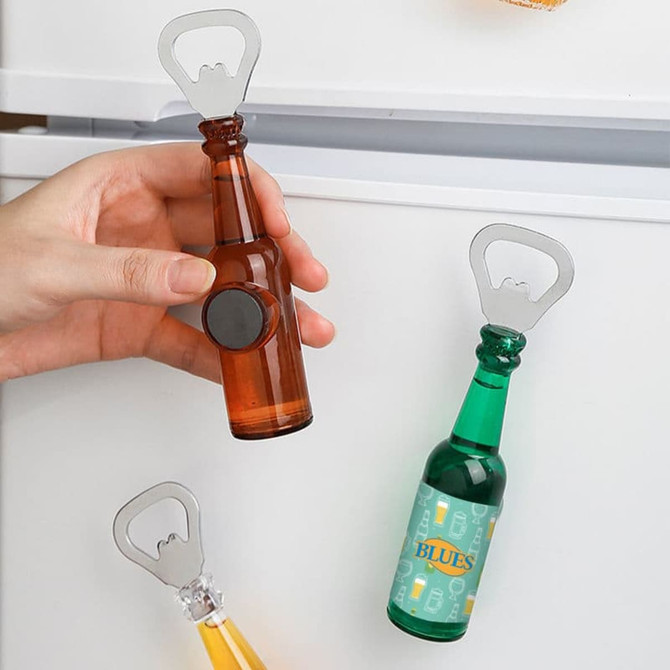 A drink bottle-shaped opener with a fridge magnet, featuring amber and green colours, and a logo on the green bottle.
