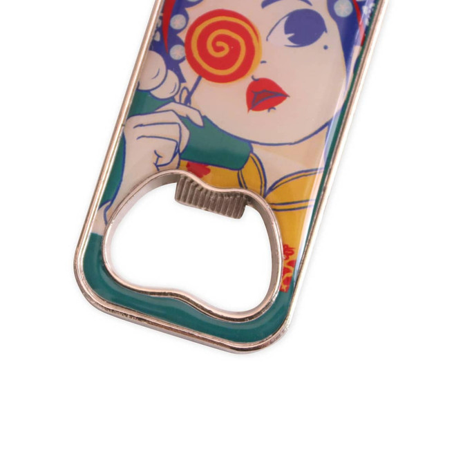 A drink bottle opener fridge magnet with a colourful design featuring a woman with a lollipop, finished in silver.