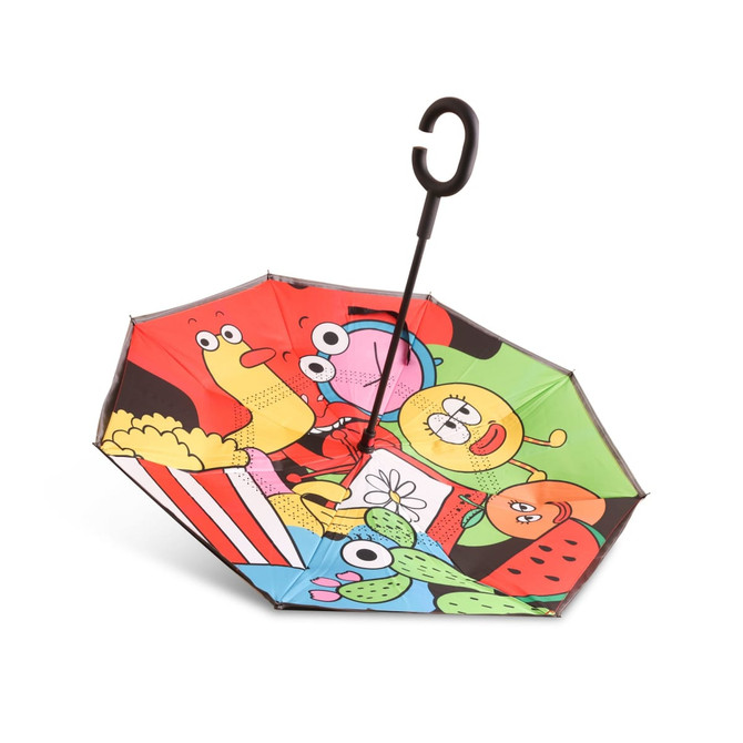A reversible folding umbrella features a vibrant design with cartoonish fruits, snacks, and playful characters in various colours.