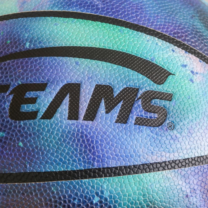 A basketball with a multicoloured, textured surface featuring a black logo. The colours range from blue to green.