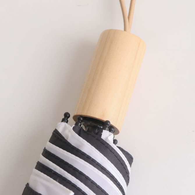 A black and white striped RPET umbrella with a wooden handle and black accents. It features a logo on the handle.