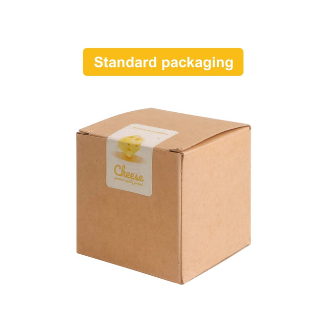 A cardboard box containing square cheese shape candles, featuring a label and a simple design.