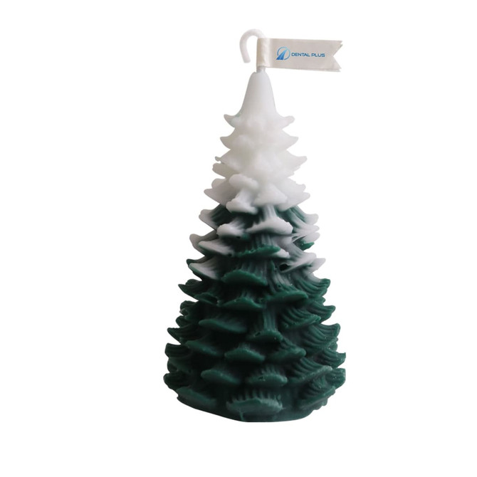 A Christmas tree-shaped candle in dark green and white, featuring multiple layered branches. It has a logo on a small banner.