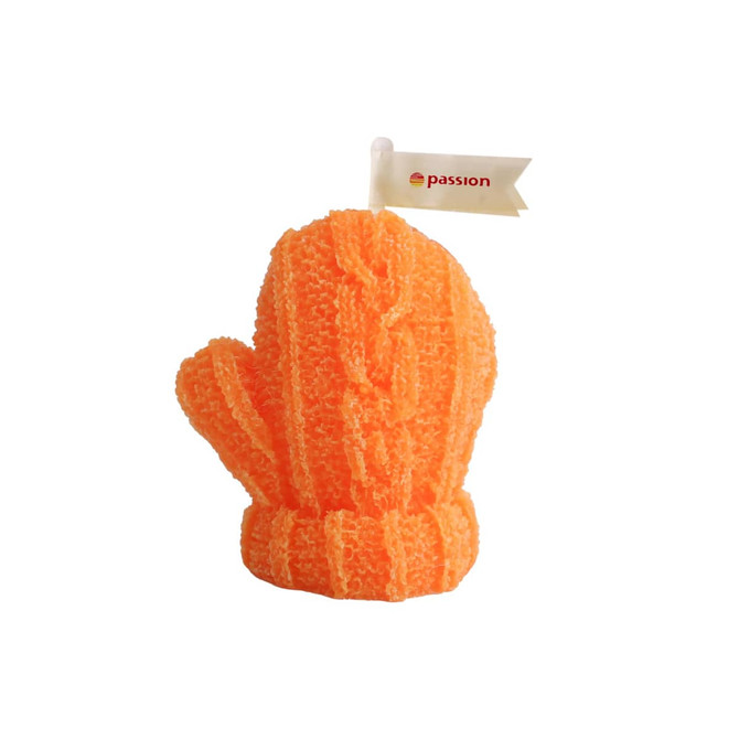 A bright orange glove-shaped candle with a textured, knitted appearance and a small flag attached.