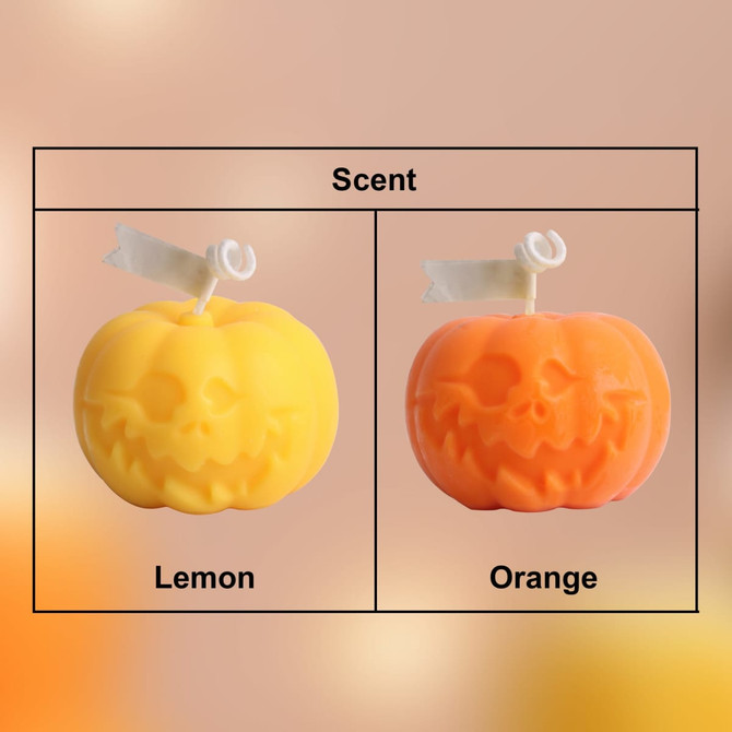 Two pumpkin-shaped candles in yellow and orange, labelled with scents: lemon and orange. Each features a smiling jack-o'-lantern face.