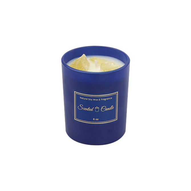 A blue glass candle featuring natural soy wax and fragrance, housed in a round container.