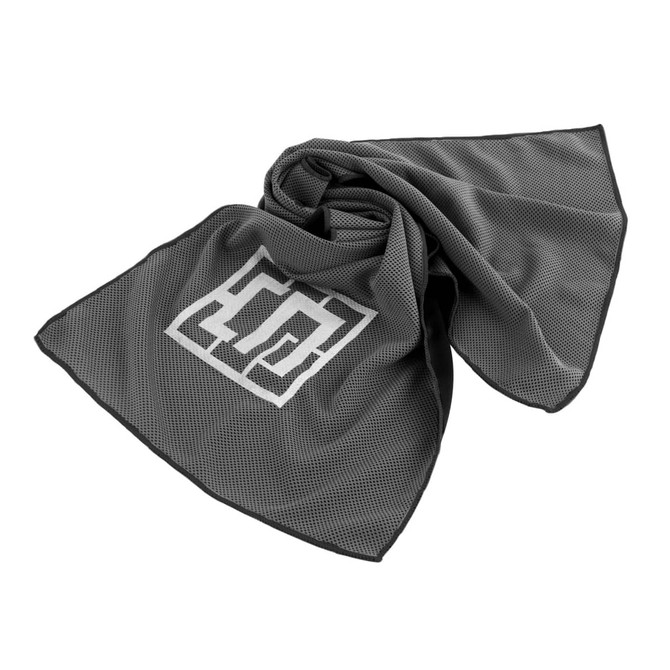 A grey cooling towel with a textured design and logo, elegantly draped in a loose arrangement.