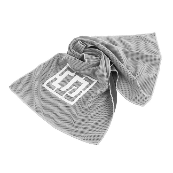 A grey cooling towel with a textured pattern and a logo in the centre.