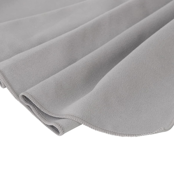A grey Quick Dry Towel with soft, smooth texture, featuring a rounded edge and a small logo.