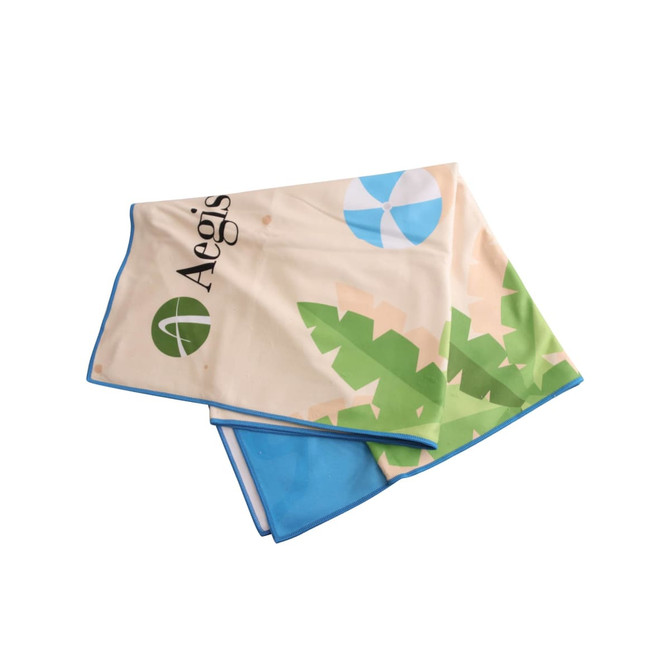 A microfibre beach towel featuring a vibrant design of leaves and shapes, with blue trim and a logo.