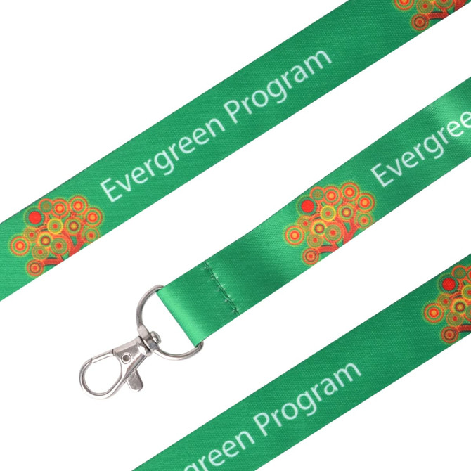 A green sublimation lanyard with a clip and decorative tree design. It features a logo.
