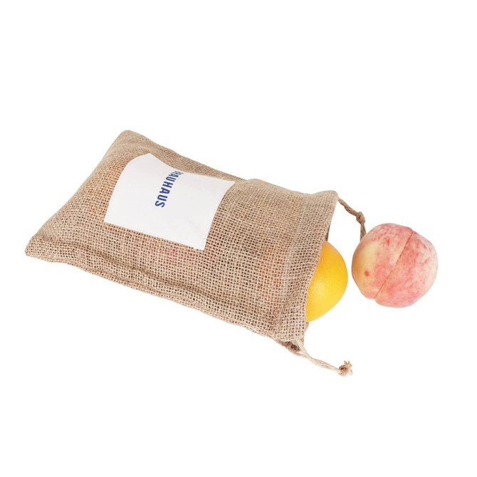A jute net produce bag in natural brown contains an orange and a peach, with a logo visible on the front. A jute net produce bag in natural brown contains an orange and a peach, with a logo visible on the front.