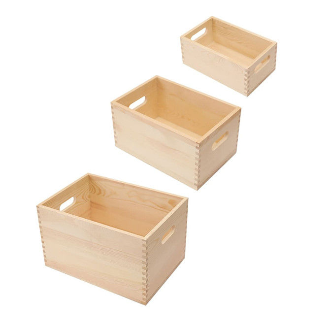 Three wooden storage boxes in natural finish, varying in size with cut-out handles for easy carrying. Three wooden storage boxes in natural finish, varying in size with cut-out handles for easy carrying.