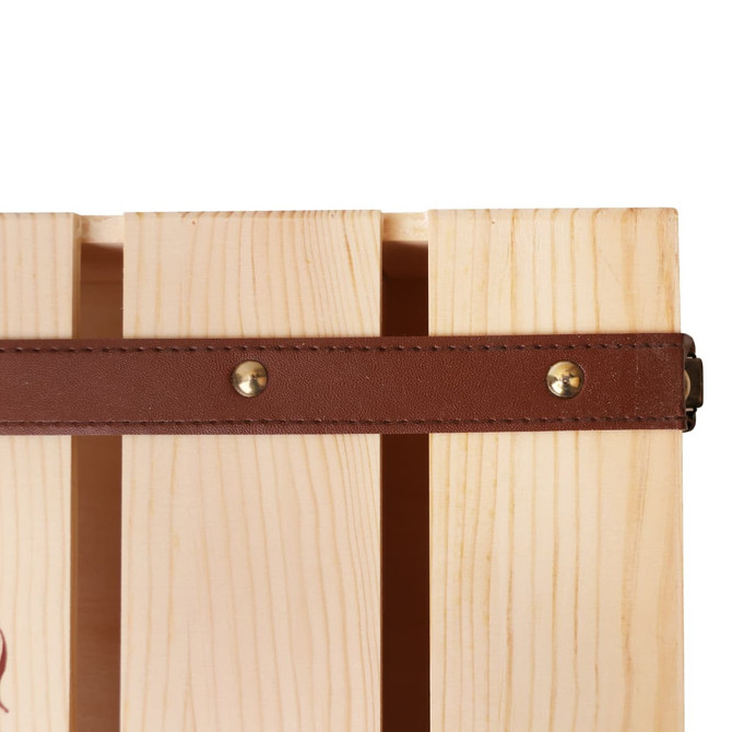 A wooden wine box with a natural finish and a brown leather strap, featuring brass studs. A wooden wine box with a natural finish and a brown leather strap, featuring brass studs.