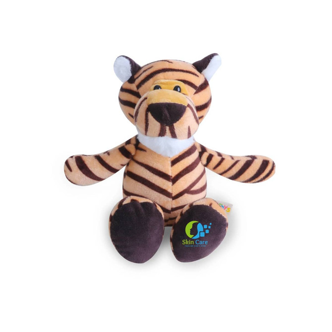 A plush tiger toy with brown and black stripes, featuring a friendly face and a logo on its side.