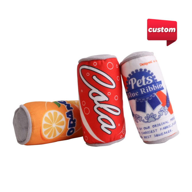 A set of three custom squeaky can-shaped pet toys in bright orange, red, and blue colours, featuring various can designs and a branded logo.
