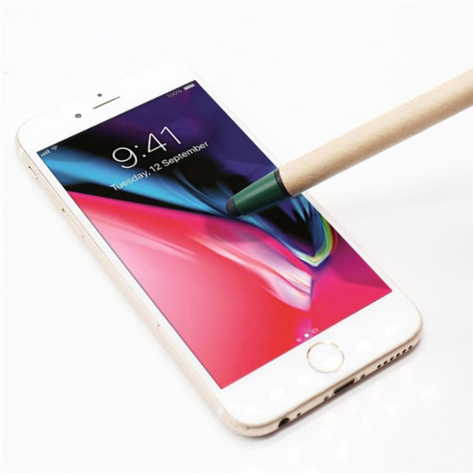 A stylus pen with a green touch head is hovering over a smartphone screen displaying a colourful background.