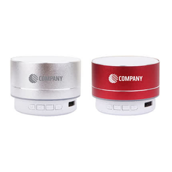 A silver and a red Metal Fashion Bluetooth speaker, both with branding, featuring control buttons on the base.