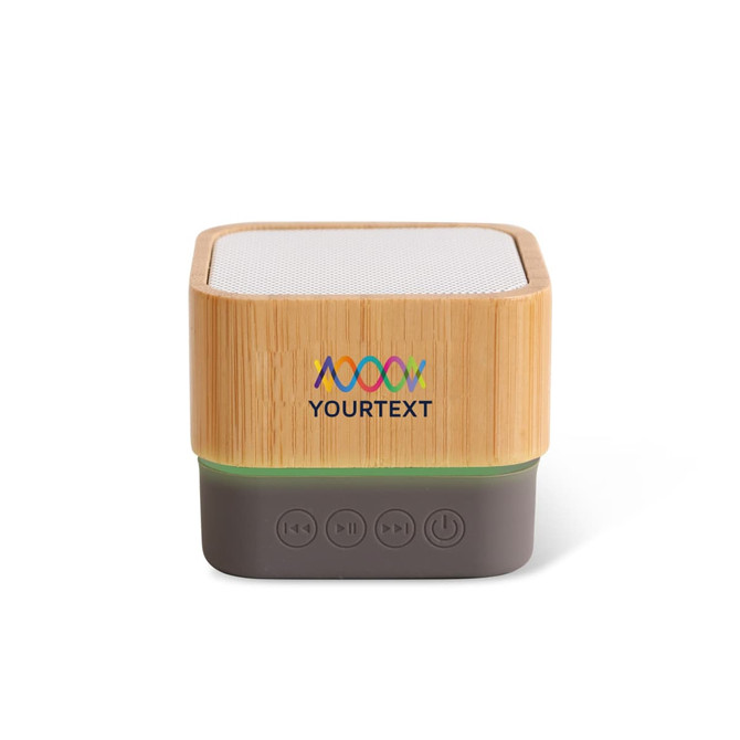 A bamboo Bluetooth wireless speaker with a grey base and control buttons, featuring a logo on the front.