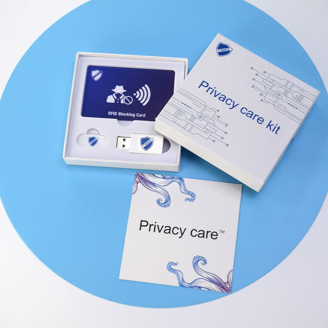 An RFID promo set featuring a blocking card, USB device, and a branded box in white and blue.