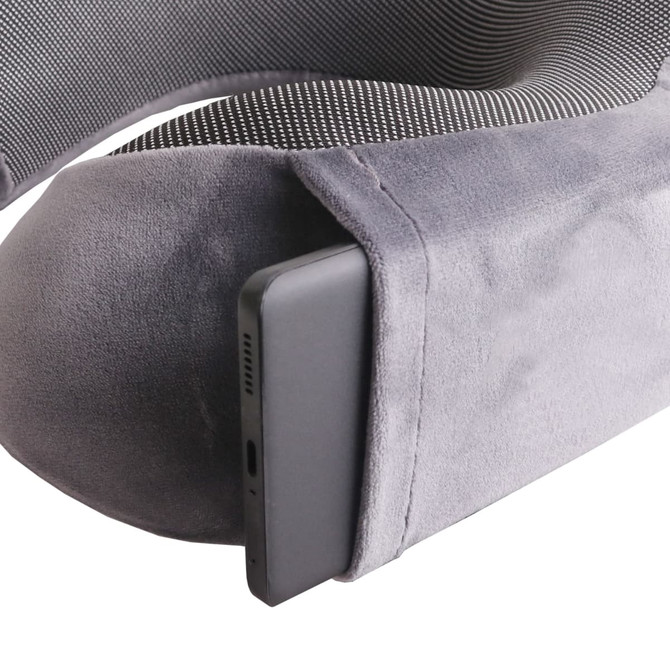 A grey memory foam U-shaped travel pillow with a pocket for a device, featuring a soft texture and supportive design.