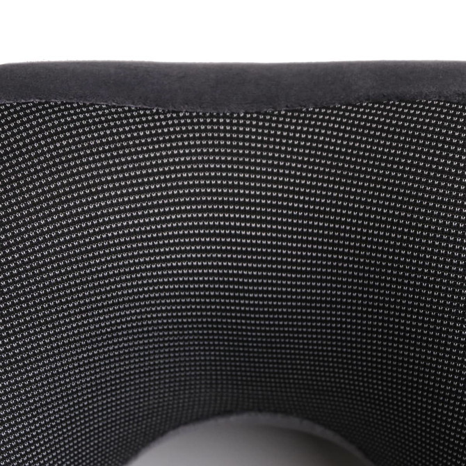 A U-shaped travel pillow in black with a soft, textured surface and mesh lining. Features branding on the exterior.